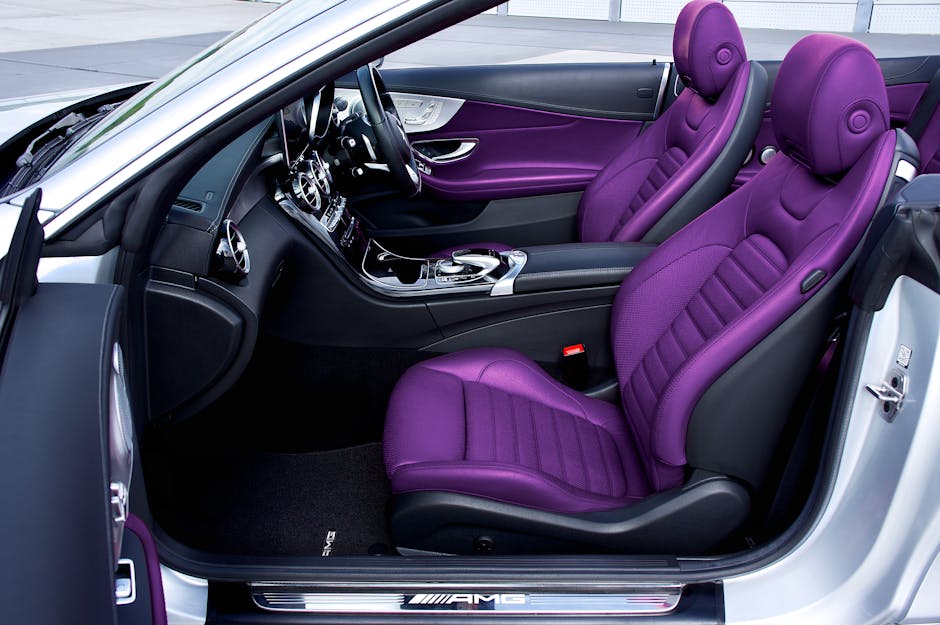 Explore the luxurious interior of a premium car with eye-catching purple leather seats and modern design.
